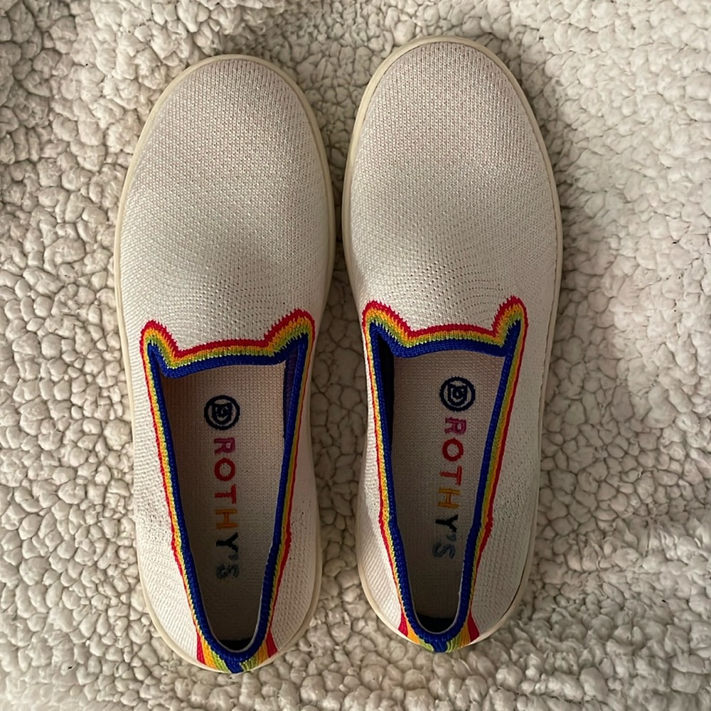 White rothy sneakers with rainbow detail